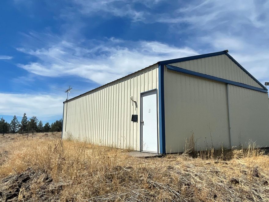 Great territorial views & some Cascade Mountain views from this big 5 acre lot with great location, & good neighbors! This partially fenced, and securely gated parcel is located a short .7 mile from Juniper Canyon Road, for an easy 5 miles to Prineville city limits.  The recreation possibilities are extensive as this lot is less than 10 miles from the fabulous Prineville Reservoir and also thousands of acres of public lands surrounding Juniper Canyon! This treed lot is slightly sloping, and has a sturdy metal shop 24'x36', a storage shed, and carport, all waiting for you to store your toys, or build your dream home! Electricity at street & a secure place for you to bring your project, or just have a lot of fun! Check out the entire lot to see the best building site to capture the Cascade Mountain views! Don't miss this opportunity! Remember, its all about Location, Location, Location!!