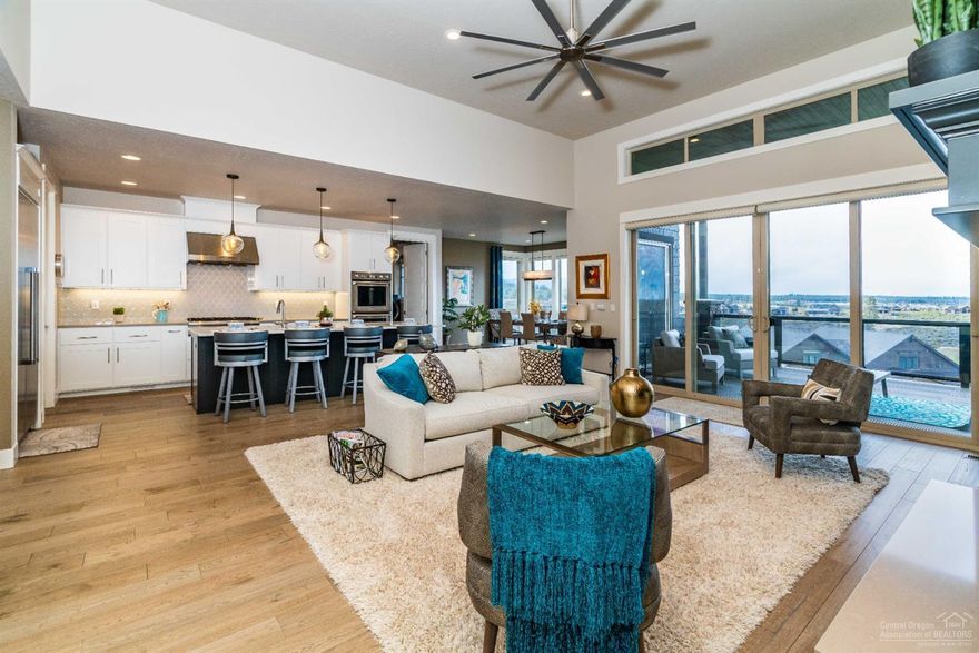 Beautiful, upgraded home situated on a premier view lot at The Rim at award-winning Tetherow Resort. This almost brand new home features many upgrades including an enlarged master suite with a very spacious walk-in closet, spa-like bathroom, fireplace and huge Cascade mountain views. The spacious floor plan is also enlarged in the laundry room area providing a more inviting space. Other upgrades include custom blinds throughout, double ovens, garage built-ins with a large work bench, extra closet systems, and acid stained concrete floor in the garage. The large, open floor plan features main level living including the enlarged master suite, another guest suite, office, laundry and open kitchen, living and dining room all overlooking the beautiful views, with an extra 2 guest suites downstairs, large 2nd living area and tons of storage! This home is truly turn key and ready to be enjoyed.