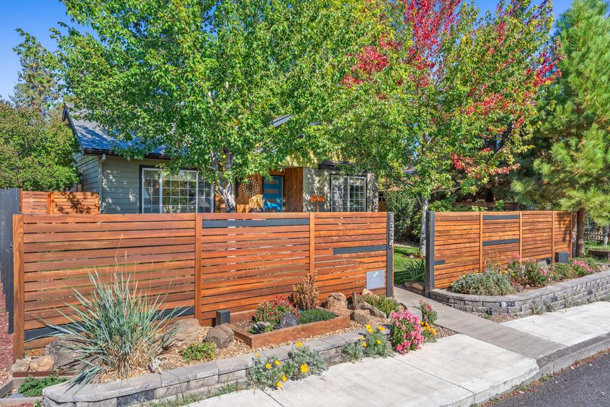 Extraordinary opportunity to own a top producing vacation rental property in Bend's popular west side. This beautiful bungalow has a prized transferrable short-term rental license and has been meticulously cared for by its current owners.  As a result, gross rental income has soared to nearly $80,000 annually. Permitted as a 6-person vacation rental, the home features 2 bedrooms, 2 bathrooms and a flex room with additional beds. The property has been professionally managed for the past 5 years and includes all furnishings and future bookings. Recent improvements include new appliances, new roof, outdoor living area updates, and landscaping. Rental clients rave about the comfortable furnishings, well-equipped kitchen, covered patio, private yard, hot tub, fire pit, and the oversized 2 car garage, ideal for storing bikes and water toys! Nestled in a prime location, just blocks from downtown, Drake Park, and the Galveston corridor, this is the unicorn you've been searching for in Bend!