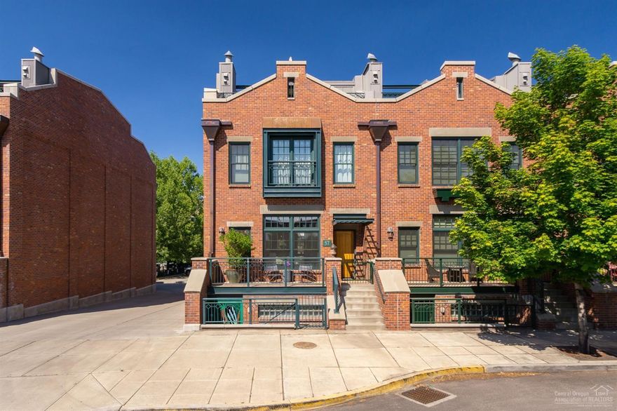 Unique, triple level brownstone style town home in the heart of Bend's urban living. The highly desirable Mill Quarter location is just moments away from Downtown, Box Factory, Old Mill District, and the Deschutes River. Enjoy beautiful views of Pilot Butte to the East and Cascade Mountains to the West from the Trex deck roof top terrace. A dream home for entertaining outside and in. The main level's large open living area flows into the kitchen complete with Viking appliances, a bright dining area, and terrace. Master suite includes walk-in closet with built in cabinets, soaking tub, tiled double shower and French doors to a lovely step-out terrace. Downstairs suite has its own private entrance. Elevator for all level access. Two car garage. Ample storage throughout. No HOAs.