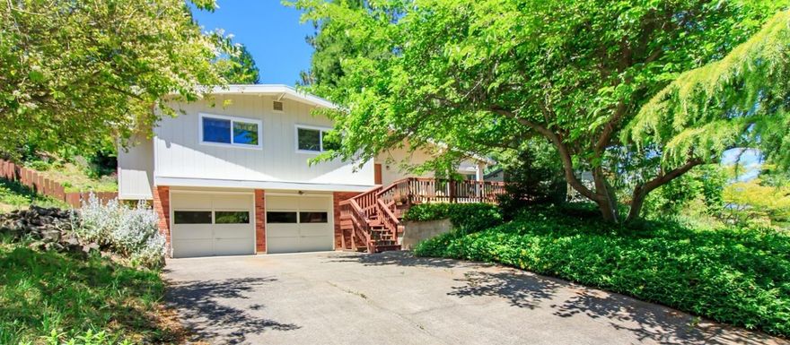 Enjoy your morning coffee on the front deck with views of the hills beyond. This cozy home is located above the boulevard on a quiet cul-de-sac, and is close to hiking trails and shopping. Cedar, Vine Leaf Maple and Fir trees give shade and privacy. Three bedrooms, three baths, with vaulted ceilings in the living room and Bay window and views to the East. The home has been well maintained with the roof, HVAC system, and all surfaces replaced, including tiled entry and kitchen, tiled baths, laminate in the living room and carpeted bedrooms. The kitchen has hard surface Corian counter tops with tile back splash trim. The generous two car garage has a laundry room in the back, with the third bath adjacent. Make this home yours and enjoy the peaceful evenings and quiet nights. Seller is licensed realtor in Oregon.