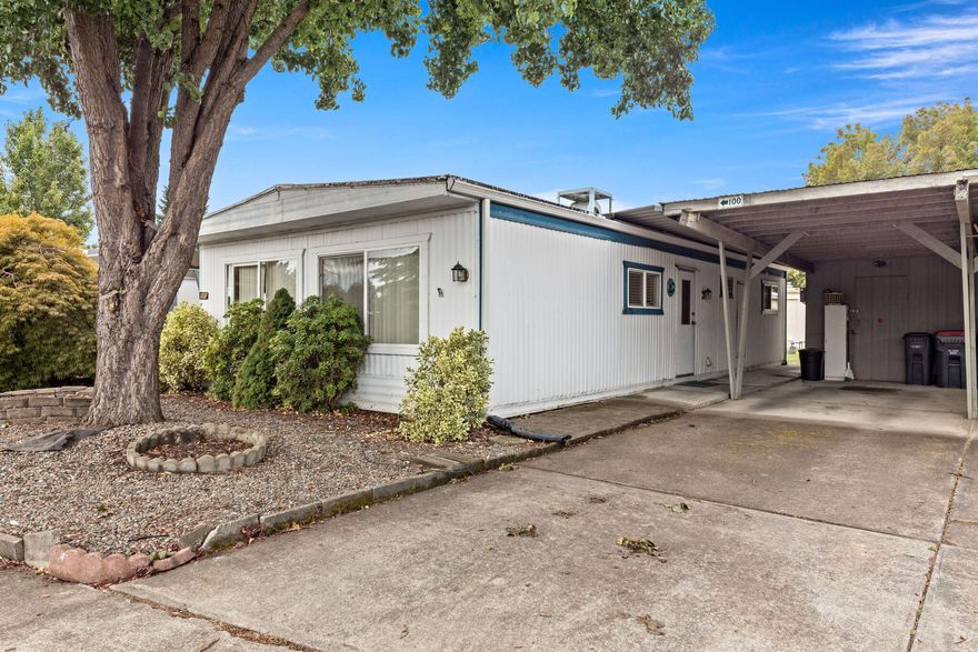 Located in the wonderful 55+ community at Aspens on the Creek. Move in ready 800 sq ft 2 Bedroom and 1 Bathroom home. Bright kitchen with plenty of storage, Gas Range/Oven, and inside laundry with the Washer and Dryer included. New Heating system in 2022. Low maintenance landscaping, Large patio to enjoy and take in the outdoors, carport and storage area. This active community Includes a clubhouse with full kitchen, game room, library, free wi-fi access and an open space for gatherings. There is also a car wash area and a coin-op laundry room. The community holds monthly activities that include potlucks, game nights and much more. Per park manager, Space rent will be $800 a month and includes trash.