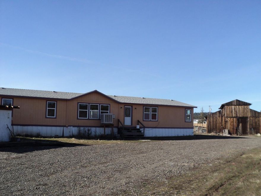 Great split level floor plan, in this updated 1998 manufactured home. 4 bedrooms, 2 baths, wonderful kitchen & mud room, Master suite with walk in closet and huge bathroom. Freshly painted inside & ready to movein! New roof and all but the kitchen and master bathroom windows are new. BIG BARN and 2 acres! Level, cross fenced. 30amp RV hook up and dump station. Property on two separate tax lots. Close in to Keno and school, yet just minutes to play in the woods, river and lakes! Good Buy. Conventional, cash or fha only.