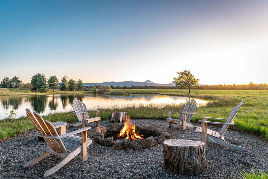 Once in a lifetime opportunity to own a stunning 40 acre legacy estate that is just minutes to Bend and delivers an unrivaled Central Oregon living experience! Offering a park-like retreat with awe inspiring natural beauty and stunning views of the Cascade Mountain range. The entire property is landscaped with beautiful mature trees/plants and a large 2 acre stocked pond that attracts diverse and rich wildlife throughout the seasons. Exquisitely designed 4 bed, 6 bath, 7643 sq ft main home was completely reconstructed in 2013 and features high-end finishes and state of the art technology. Covered outdoor space w/wrap around deck, stone fireplace and bbq area. Huge 4 car garage w/RV/Boat space. Additional structures:  1,993 ft guest house, 7 stall barn w/large entertainment area upstairs, huge indoor arena that can be easily converted to a sport court or a space for car collections, outdoor arena, 12 paddocks, 3 acres of pastures, hay barn and 20 acres of hay. Check out the video tour