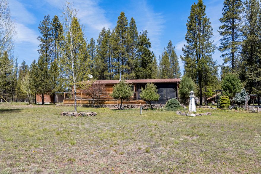 Seller Offering Painting Allowance with offer. Have your broker or agent contact listing agent with details. Sales Price Includes additional lot. This clean and cozy 2 bedroom, 2 bathroom, 1278 square foot manufactured home built in 1992 with log siding accents looks over a Sun Forest meadowed area. This home has multiple outbuildings and garden areas. Seller has an additional acre parcel included in this  sale. Located just miles from downtown La Pine, this would make the perfect home! Call your favorite Broker to come view this great home.