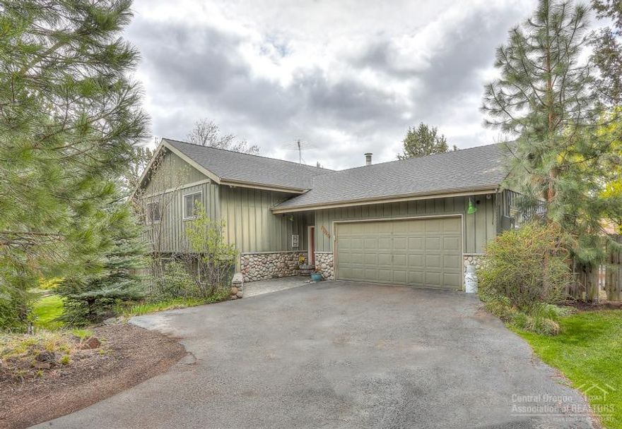 Super SE Bend 2000+ Sqft. Home on Half Acre! 4 Bedroom home + Office/5th features: River Rock stone fascia, covered porch w/stamped concrete, Vaulted Great Room w/wood-lam flooring, open dining/kitchen w/tile floor, SS appl, large/separate Family Room w/wood-lam floor & gas log stove w/gorgeous river rock hearth/surround, big laundry/craft area, 2+ att garage w/pull down stairs to extra storage, huge upper wrap deck + huge fenced backyard w/Hot Tub & double gate for RV/Boat parking, gas FA heating!