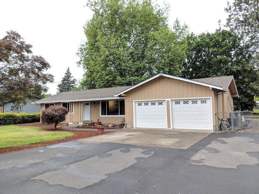 Gorgeous 4 bedroom/ 2 bath home on almost 1/2 acre. Huge RV parking, covered patio. Open floor plan, dining area, kitchen has plenty of cabinets and counter space, breakfast nook, updated inside and out with fresh paint! Walk into this home and notice the large living area with windows allowing natural light to flow. This home has so much potential, hard to find a home with 4 bedrooms on a lot of this size. Huge corner lot room to park the toys.