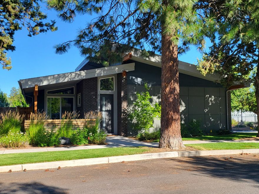 Location & design set this potential short term rental home apart from other offerings! In the Old Mill District with easy access to canal trails, shopping, eateries, coffee shops & Mt. Bachelor. Single level, beautifully appointed 3/2 with sunny kitchen featuring huge island, stone counters and skylights. Front courtyard patio, side covered deck with fire pit. Heaters, TV, back deck, Marquis hot tub (negotiable), fenced yard, storage shed.. Big finished garage with 9' door, RV parking/plug. Low maintenance & ready for new owners.  NO HOA!