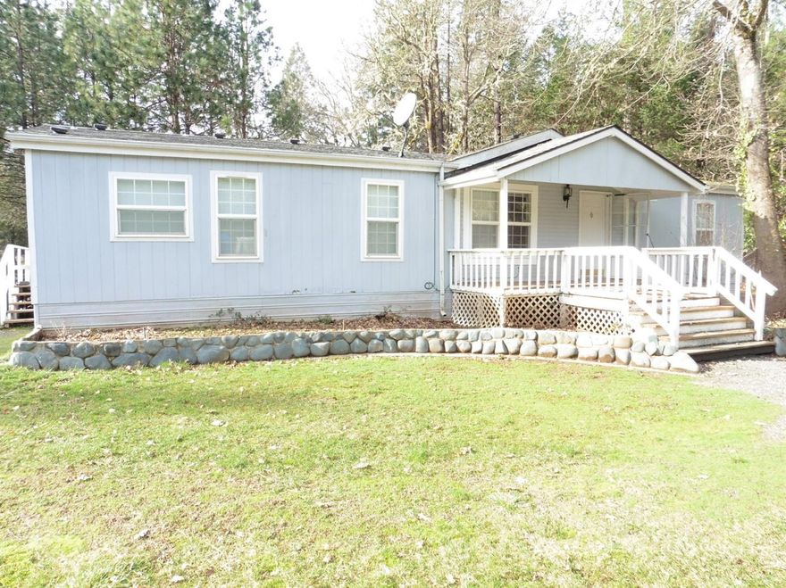 IDEAL COUNTRY LOCATION to take advantage of all the Recreational Benefits available in the Rogue River Corridor. 3Bdrm., 2Bath Mfg. Home with Den. Front & Back Covered Decks. Split Floor Plan. New Heat Pump in 2016. New Fridge in 2014, Dishwasher in 2015. Oversize 2 car detached Garage. Outbuildings for your Livestock. Country Location offers approx., 2.44 flat, level acres and surrounded by similar size parcels. Plenty of room for your garden. End of the Road Privacy & Seclusion. Short walk over nearby BLM land at the end of the Lane to the Wild & Scenic ROGUE RIVER for Fishing & Boating. Griffin Park & County Boat Ramp about a mile from property. Short walk to the Riverbanks Country Market. All information deemed reliable, but not guaranteed and subject to change. Buyer to do their own Due Diligence