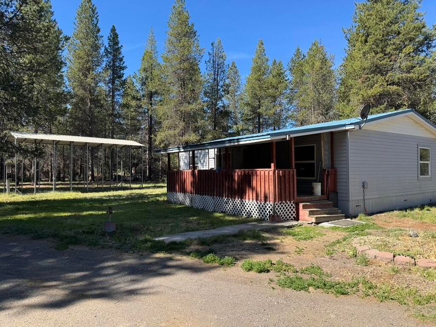 Affordable 3 bed, 2 bath manufactured home on 1.15 treed acres in La Pine! Great starter home with 1,080 sq ft, split-bedroom layout, open living space, and a new well (2021). Includes a large detached shop, RV storage, and plenty of room to grow. Minutes from the Deschutes River, Tetherow Boat Ramp, and Deschutes National Forest—perfect for fishing, boating, hiking, and more. Peaceful setting with tons of potential. Being sold as-is, this home is a great opportunity to enter the market at an affordable price and build equity over time. With a little vision and effort, you can transform this into your ideal home base. Seller is a Licensed Realtor in the State of Oregon.