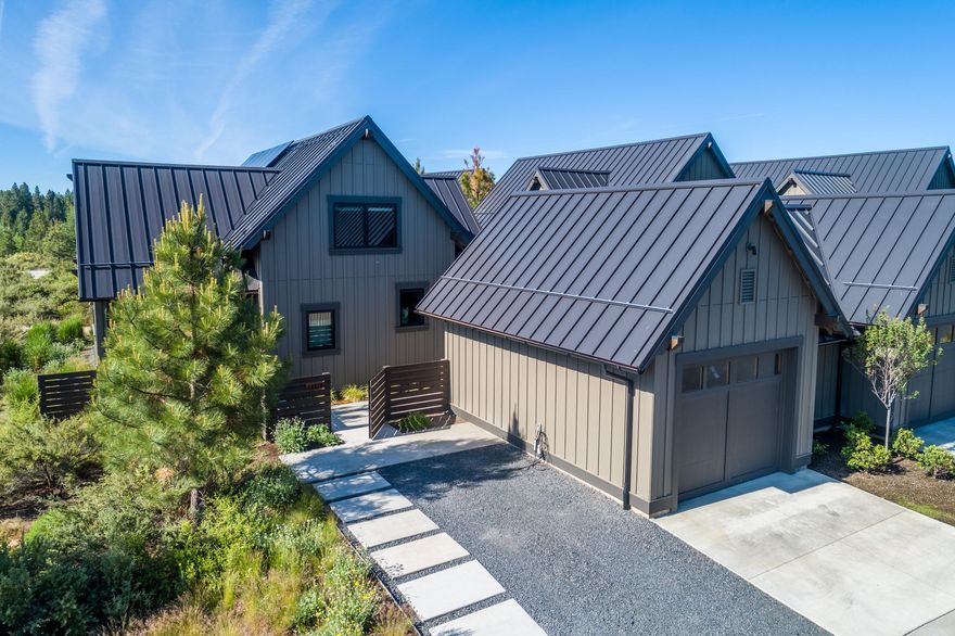 Beautiful light and bright Rustic model Tetherow Cabin perfectly located at end of street creating a private setting overlooking Alpine Park. Two master suites one on main level, and one upstairs. This Earth Advantage Gold Certified home has over $37,000 of upgrades that include a 5KW Solar PV System and electric car charger. Open concept chef's kitchen with high end Kitchen Aid appliances, solid surface counter tops, custom cabinetry, vaulted ceiling great room, wide plank French oak hardwood flooring, stone and onyx vessel sinks, freestanding soaking tub, and fire pit on the private patio are just a few of the outstanding features of this special home. Large detached garage with extra storage to easily store all outdoor toys. Just a short distance from Tetherow Golf and Clubhouse, Tetherow Restaurants, Tetherow Sport facility, Phil's Trails, Mt. Bachelor, Cascade Lakes, and the Deschutes River Trail. Perfect launching point to all the outdoor amenities of Central Oregon.