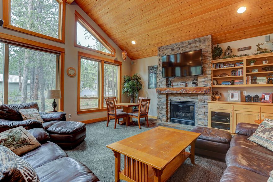 Beautiful lodge style home located in the heart of Sunriver, close to SHARC!  Wood/log accents throughout give this home a warm, Sunriver feel. 4 master suites (2 suites on the main level) plus a 5th bedroom/bonus room w/ wet bar and attached office. Spacious open floor plan is perfect for large groups. Vaulted wood ceilings and floor to ceiling rock/gas fireplace in the great room.  Gourmet kitchen w/ granite counters, stainless appliances, gas cooktop, 2 dishwashers, 2 ovens and 2 pantries.  A/C, large laundry/mud room w/ 2 washer/dryers and 3 car garage for your toys. Great outdoor space with newer hot tub.