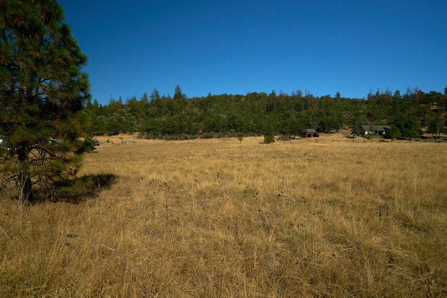 Scenic 7.44-Acre Lot in Eagle Point - Ready for Your Vision. Welcome to this incredible 7.44-acre property located on Montana Vista Ct in Eagle Point. This beautiful parcel offers a blend of open space and a tree-lined hillside on the east side of the property, perfect for privacy and enjoying nature. With sweeping mountain views and a serene rural setting, this RR-5 zoned property provides the ideal canvas for your custom dream home. Whether you envision a modern farmhouse, a rustic retreat, or a luxurious estate, the possibilities are endless. Bring your architect and let your imagination take shape in this scenic location