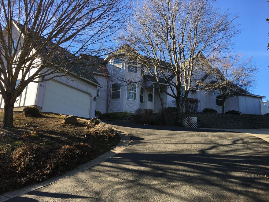 Spacious 2798 sq ft home (As of 4-21-21 this Residential Home is the lowest residential price per sq. ft. in Ashland) on a large 0.30 lot In Greensprings Sub #3 features: formal entry w/cherry wood flooring leading to a formal dining room, kitchen w/granite counters, wood cabinets & tile floor + yard access,  and huge living room with 18+/-  ft vaulted ceiling, gas log fireplace and back yard access.   This home offers 2.5 baths and hard to find 4 Bedrooms plus a den/office or possible 5th bedroom. Main level primary bedroom suite  w/vaulted ceiling, jetted tub, separate shower, double vanity & granite counter.  Two walk in closets plus French doors to your patio and back yard area.  Two bedrooms and full bath upstairs and a 1/2 bath & large 4th bedroom  w/vaulted ceiling above the garage.  Good natural light throughout most all of this home.  Step down to an oversized 2 car garage.   Small hobby or workshop room on the side of the house, approx 6.6 X 11+/-. Newer HVAC system 12-20