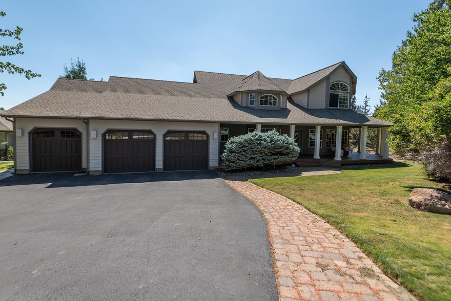 Welcome to this classic Awbrey Butte home located on over a third of an acre with city and SE facing views. This charming home has been tastefully remodeled and will not disappoint. On the main level, you'll enjoy the gourmet kitchen w/a center island, farmhouse sink, Viking and Wolf appliances, a wine fridge, and pantry, a primary bedroom w/a fully remodeled bathroom w/dual vanity, heated floors, a walk in tile shower, soaking tub, and access to the exterior deck and hot tub, a designated office, dining room, breakfast nook, a spacious living room w/a gas fireplace, powder room, and a laundry room w/a sink and built ins. Upstairs there is an en-suite bedroom, and two additional bedrooms and bathroom. With big windows, and vaulted ceilings this airy home offers a ton of natural light, beautiful hardwoods, ceiling fans, central vacuum and an attached three car garage w/extra workspace. Come fall in love, soaking in the serene setting from the large back deck, or the covered front porch