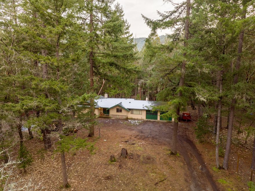 Welcome to 350 Surrey Drive! This well maintained 1736sqft ranch style home offers 2 bedrooms, 2 bathrooms, large living room, dining room, large kitchen & potential for a 3rd bedroom! Some interior features  include new paint, flooring, & German smeared fireplace. Exterior features include peaceful 1.19 acres, fully fenced, covered patio, & a seasonal creek! This one won't last long!
