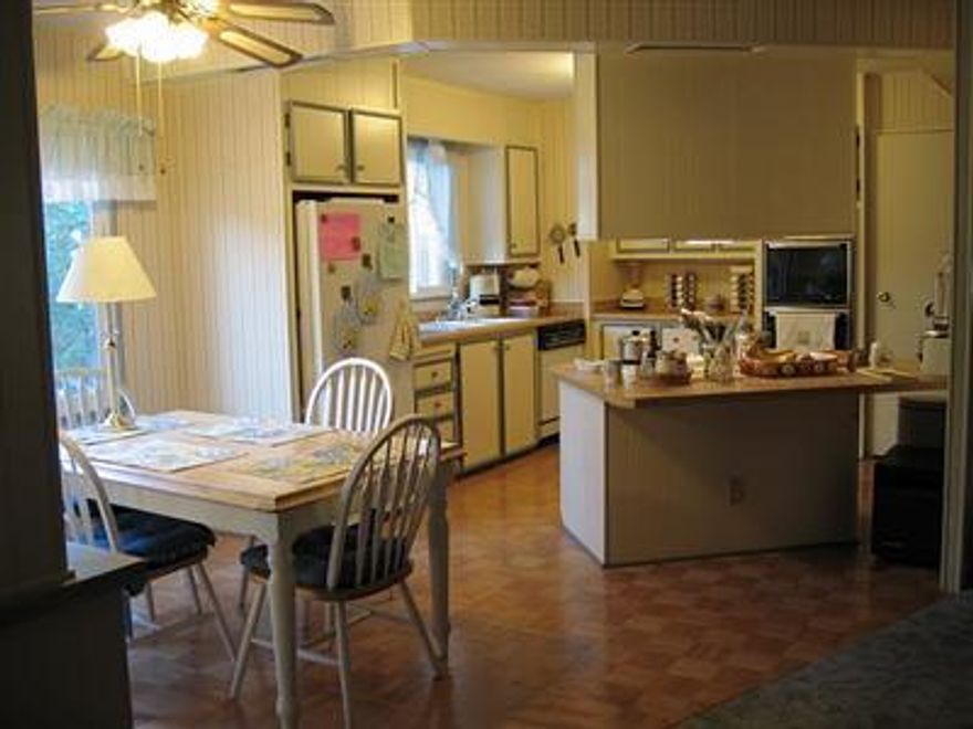 Well-maintained double-wide in a peaceful & safe park-like setting. Kitchen, dining room, living room, and den are all open to each other, master bed and bath are a good size with split floor plan; home is 1758 SF per Owner, and feels open and spacious. Kitchen has island, ceiling fan, and updated appliances. Home has new roof & gutters, energy-saving dual-pane vinyl windows, upgraded floor insulation, new front landscaping, a large screened porch, a 7x10 ft tool shed and 1 carport. Located in desirable 55+ pk surrounded by park-owned fields & hills. Quiet neighbors.