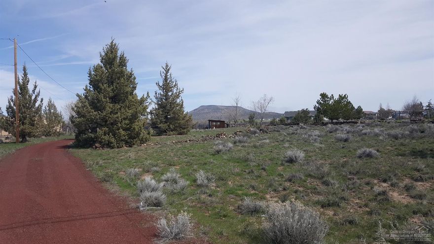 Amazing Rimrock and Cascade Mountain views from this lot in beautiful Crooked River Ranch. Lot is located on the edge of the rim so the views are protected. Flat building site with electricity, water, and septic already installed. Small storage building on site, was previously used as RV site. Golfing, community swimming pool, tennis and pickleball courts, hiking and fishing. A welcoming community waiting for you!