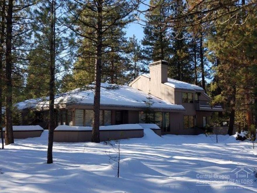 Special and exciting home with many windows overlooking a 1.49 acre lot. Easy access to National Forest, GM Sports center & GM Golf. Spacious rooms & vaulted ceilings enhance clear cedar paneling & extensive use of wood. Well designed kitchen w/casual & formal dining overlooking a large living room w/natural lava stone fireplace. Main level master suite has jetted tub, sauna & adjacent den/office. 2 bedrooms up, 1 w/fireplace. Multi purpose room in attached garage. Expansive decks for outdoor living.