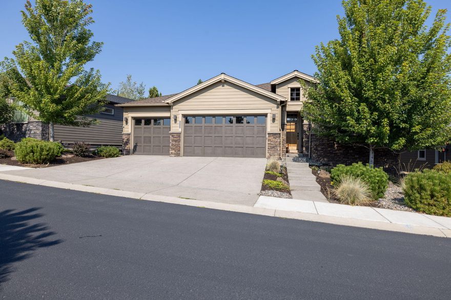 Wonderful Price Adjustment!  This immaculate, single-level Pahlisch home represents one of the best values in NW Bend. Vacant & move-in ready, this high-quality modern residence offers stunning territorial views, direct trail access, & proximity to the nearby golf course.  The inviting entry opens to a spacious great room featuring soaring ceilings, a stacked-stone fireplace, custom built-ins, and expansive windows that fill the home with natural light. The chef's kitchen is beautifully appointed with KitchenAid appliances, a 6-burner range, quartz countertops, walk-in pantry & alder cabinetry.  The primary suite includes a coffered ceiling, soaking tub, tiled walk-in shower, and a large walk-in closet. Additional highlights include engineered hardwood floors, 9-foot ceilings, 8-foot doors, and a spacious 3-car garage.  Outdoors, relax on the covered back patio, enjoy low-maintenance yard, or head straight out to nearby trails w/ quick access to the Deschutes River & Downtown Bend.