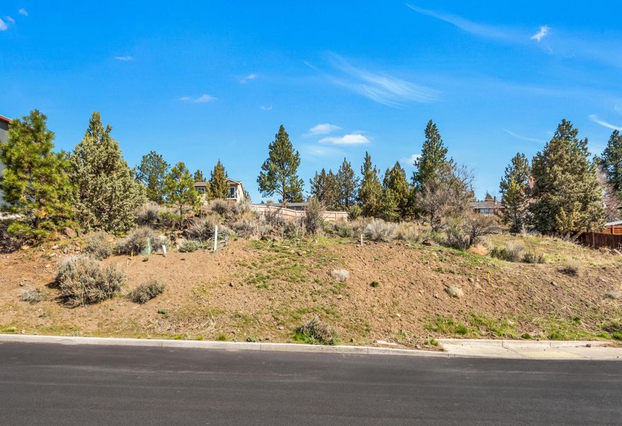 This is a rare opportunity to build your dream home in Bend's desirable Westside. Blocks away from Newport Market and Galveston corridor. 50' x 130' gently sloped .15 acre, corner lot with unobstructed southern exposure and views offers incredible passive solar and solar opportunities. Conveniently located close to Downtown Bend, numerous restaurants and shops. Water, sewer, and natural gas are at the lot. Conduit is in place for electricity, phone, and internet from the junction box and transformer across Ogden Ave. Ready to build!