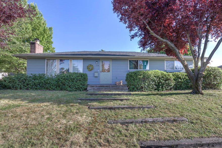 Classic 1960's built E. Medford home.  Great floor plan offering 3 bedrooms,  2 & 1/2 baths, and 1419 square feet.  Large .21 acre corner lot with RV parking, garden shed, and an oversized 480 square foot two car garage with double doors, built in storage, and workbench area.  This property features tremendous character from the era, both inside and out, with its wide covered breezeway providing access to a huge trellised patio in the backyard, or alternate access to the home through double glass doors into the kitchen and well lit breakfast nook area.  Also in this area of the home is the indoor laundry room and convenient 1/2 bath.  A pocket door through the kitchen leads into a formal dining area with laminate floors, charming great room with beautiful brick fireplace, and large bedrooms. New 40 year roof, heat pump, and flooring throughout installed in 2015.  Too much to list . . . hurry, this won't last long.