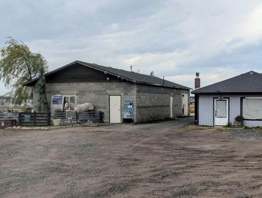 MAJJOR PRICE REDUCTION. 
Hwy 97 frontage directly south of Pershall/Oneil Hwy. New Hayden residential community and Redmond City limits abut south property line. Existing block warehouse presently configured as live-work unit. Additional 768 sq.ft. vacant 2B.1Ba residence and a 600 sq. ft. private well pump house. This is Ground ZERO for Redmond NW expansion.
Septic system pumped and inspected 7/25 and reported as good condition. New  Redmond waste water treatment expansion lines to Wetlands Project in process now and directly west of site.  Cash /terms may be considered.