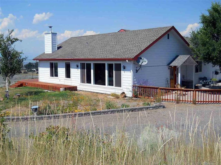 Fantastic View From Every Direction. Open Floor Plan With 2 Master Suites. Beautiful Kitchen. Wrap Around Deck. Large Sun Room And Spacious Patio. 1715 Sq. Ft. Garage/Shop W/Bathroom, Rv Door & Certified Wood Stove And Overhead Storage. Home Has Tons Of Storage. This Home Is Being Sold With Lot Next Door.