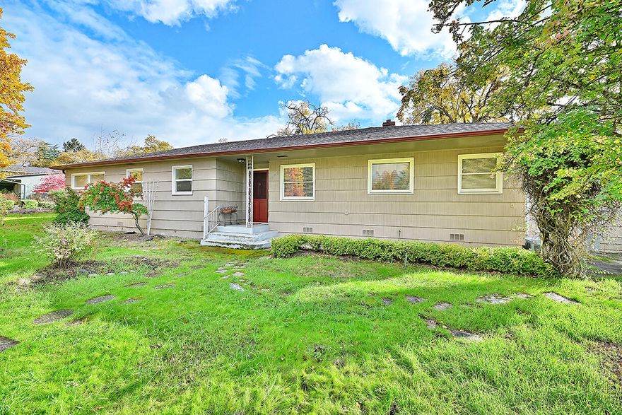 This charming Old East Medford home sits on a large .40 acre corner lot, conveniently located close to I-5, within minutes to schools, parks, medical, restaurants and shopping. The traditional 1,555 SF ranch style home offers a large living room with a wood burning fireplace and huge picture windows that allow for an abundance natural light to fill the room. The cozy dining room leads to the galley kitchen with a breakfast nook and a dedicated laundry room/pantry with floor to ceiling cabinets on one wall, as well as above the washer & dryer.  Down the hallway you will find 3 bedrooms, each with original hardwood floors, along with 2 bathrooms, as well as more built in cabinets and shelving for additional storage. The large yard beckons with endless possibilities, both in front and in the back, with room for an Accessory Dwelling Unit up to 900 SF, per Medford Planning Department. Don't miss out on this rare opportunity to invest and build equity!