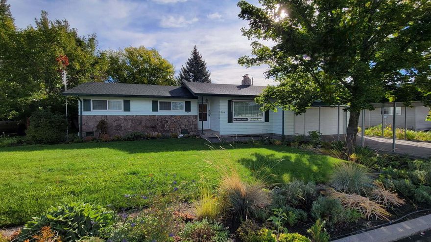 This extremely well-maintained home and property are in a desirable, quiet neighborhood in SW Prineville. Home has 3 bed, 2 baths, a large mud room, hobby room, study or office with access to garage. Large primary bedroom with walk in closet, bath with double sinks and tile countertops. Living room has a new wood burning fireplace insert. The kitchen has all the original cabinets, in great shape and a newer tile floor. The dining area has a sliding door that opens up to a fully enclosed sun porch with lights and several windows for natural light. A separate sliding glass door enters into the back where concrete walkways take you throughout the landscaped area. There are three outdoor sheds which consist of a garden shed, a potting shed and a fully insulated shed with power for a workshop, office, playroom/game room or a multitude of things. Large gate on south side for RV parking. Irrigation well with nice set up and drip system.