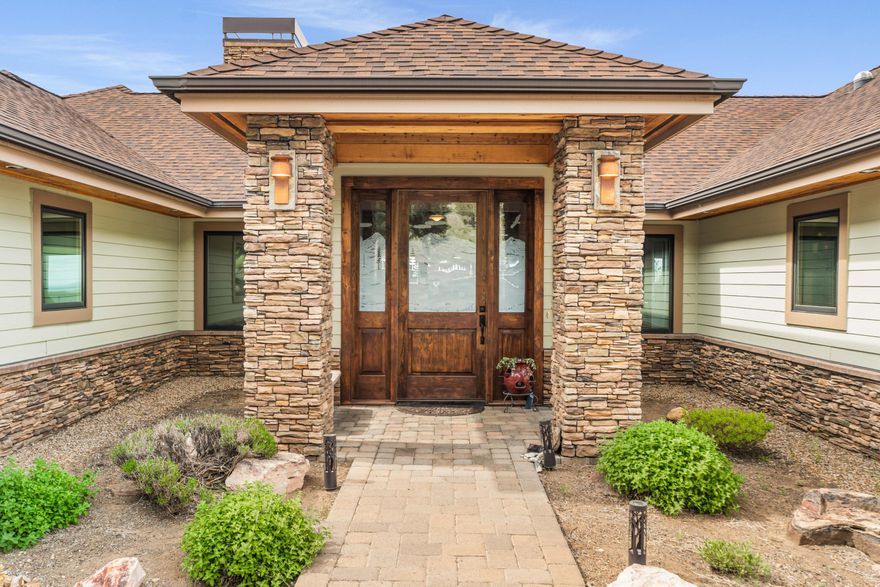 Stunning one level home with glorious Cascade Mountain & Smith Rock Views; enjoy high-end construction throughout w/solid wood doors, trim & built-ins, granite, tile, natural stone finishes. Designer door welcomes you into the warm and inviting living area that flows seamlessly to all rooms. Step out to the covered, paver trimmed deck for the high desert crisp air and pine smells. The entertainer's dream kitchen with high-end appliances, various prep areas for food & beverage, amenities galore. The bright, open sunroom is an excellent versatile living space. Bedrooms are en-suite with walk-in tiled showers. Primary suite w/ walk-in closet, living area, spa-worthy bathroom w/radiant floor heat, deck access. Plus, Zoned HVAC, 3 car garage plumbed for gas heat, exterior room w/endless possibilities, plumbed for central vacuum. Come experience the breathtaking views in a harmonious blend of craftsmanship, comfort, and convenience, in one of Eagle Crest's most desirable locations!