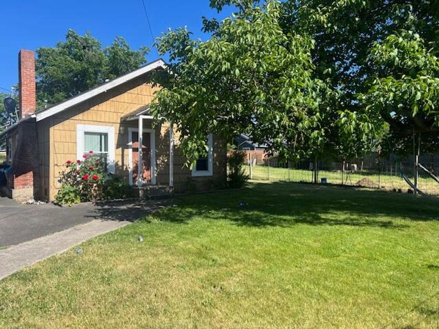 Feel like your living out in the country on this huge .86 acre lot! Adorable 2 bedroom cottage offers open living and kitchen area. Home also has laminate floors, central air, and vinyl windows. Detached carport plus storage available. Plenty of room to park all your equipment, toys, trailers, RV's, etc. Or explore and create your own subdivision! Either way the options here are endless.