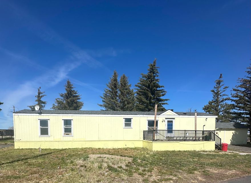 Welcome to this move-in ready 2 bedroom, 2 bathroom home located in a quiet and established mobile home park. This home offers a spacious open layout with updated flooring, LED lighting, and plenty of natural light throughout. The kitchen features ample cabinetry, and room for a dining area. The large primary suite includes a walk-in closet and attached bath with a walk-in shower. Enjoy peace of mind with a roof that's less than 3 years old. Outside, you'll find a large front deck, a ramp for easier access, a large shed, and a 12x20 building with electric and A/C—perfect for a workshop, studio, or extra storage. Affordable living with a fresh feel—schedule your showing today!