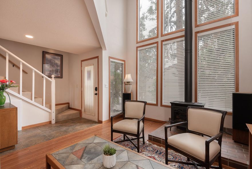 Perfectly placed and affordable condo.  Only a few blocks to river trails and downtown Bend.  Natural light from the floor to ceiling windows streams in and illuminates the heart of this home. Inviting and private back deck and upper front balcony both boast views of mature trees and landscaping.  The well thought out floor plan allows for separate living spaces to meet the needs of the purchaser.  The owner has invested in many upgrades to increase energy efficiency including a new heat pump (with central AIR CONDITIONING) and air sealing.  Please see attached docs for a list of owner additions  New high-end washer and dryer, refrigerator, and stove are included in the sale!