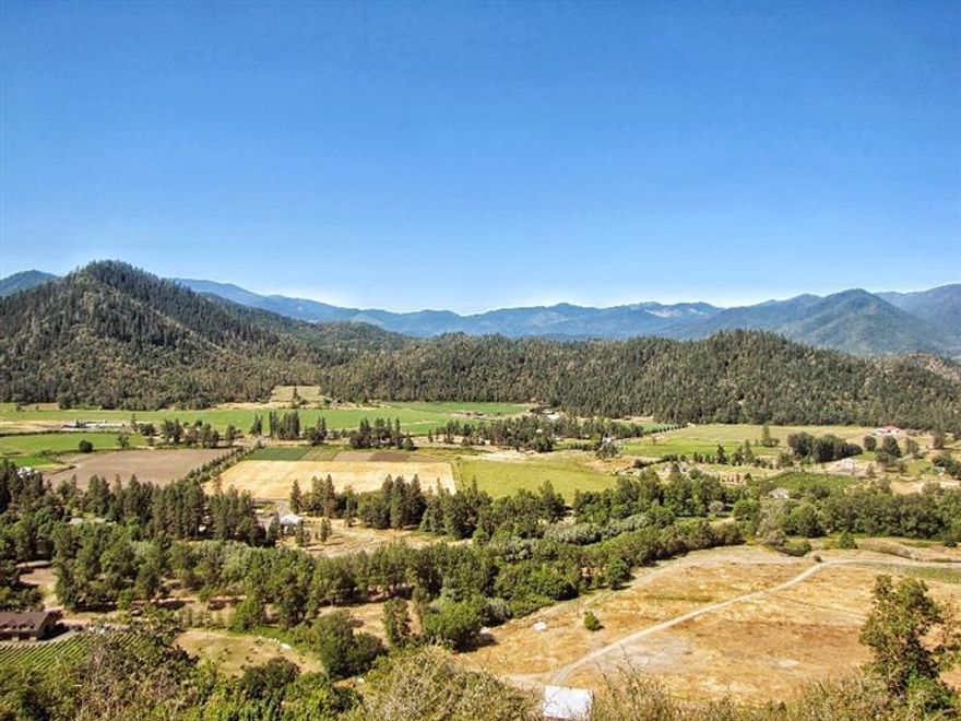 Gorgeous Applegate Valley Ranch! The legenday Krouse Ranch is the very essence of the Applegate Valley. This 275+ acre Vineyard property lies in the middle of the exploding Applegate Wine Country! With over 1/2 mile of Applegate River frontage, 2 large ponds, and over 40 acres of Pinot Noir/Cabernet, this property is ready for the next level. The 165 acres of primary and secondary irrigation rights, dating back to the 1800's, allows for expansion of the vineyard and Measure 49 allows for additional homesites with expansive views of the valley below. Beauty surrounds every inch of this property and there are several locations for a high end tasting room or wine cave. This will be a must stop on the Applegate Wine Tour! Don't miss the chance for a must see property in a must have location ~