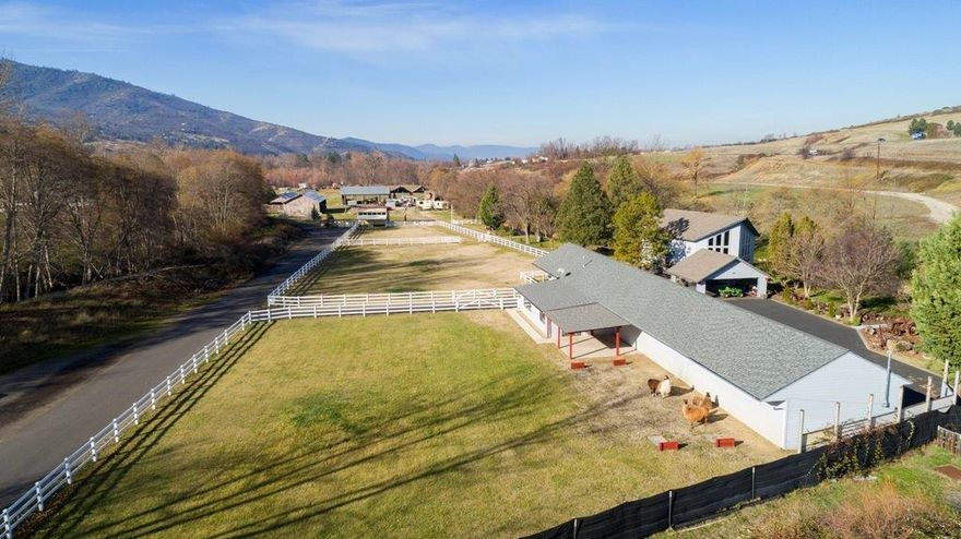 One of a Kind! Located adjacent to Ashland city limits, this 20.98 acre, creek front paradise is spectacular! The beautiful creek side home has a fabulous open beamed, cathedral ceiling, spacious master br loft & gas fp for those cool evenings. There is an indoor sauna & outdoor hot tub. Across from the house are the guest qtrs w/1/2 bath, 2 fenced pastures & a 10 car garage w/a wet bar & game rm. A vintage 1940's gas station building was moved to this property & has been restored & used as a shop w/ lift. The garden house is the perfect place to grow flowers and below it is a cellar, which would make a nice wine cellar. There are several large out buildings & covered parking areas. This property would be great for horses or agriculture as there are large fields & open area. 2 tax lot. The possibilities are endless! Property is connected to city water & it has a well. The home can also be hooked up to the city sewer. Irrigation rights may be available for a separate purchase.