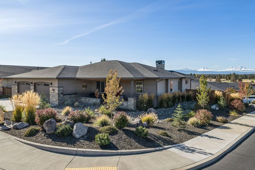 Located in the exclusive Forked Horn Butte area, this elegant home has it all! On a large corner lot with panoramic views of the Cascade Mtns from Mt Bachelor to Mt Jefferson, it has a Gold EarthAdvantage certification,Xeriscape landscaping and the most perfect one level floor plan you'll ever live in.The elevated back paver patio faces the view, has sun protection and the warmth of a gas fireplace so you can enjoy it all year long. The kitchen has quartz counters, tons of storage and prep space, a butler's pantry, a walk-in pantry, a gas range, stainless steel appliances, cool tile -and WOW views. The Copper Ledge stone fireplace and bar nook in the great room create a warm ambiance and the colors are serene. Newly built, pls,see attached 4 page list of upgrades: a 2stage furnace, appliances, gas fireplace, carpet, closets, garage doors, lighting, sun shades. The cost of living and slow pace of life are a big bonus to living in Redmond. 10 minutes to the airport.  Please visit soon!