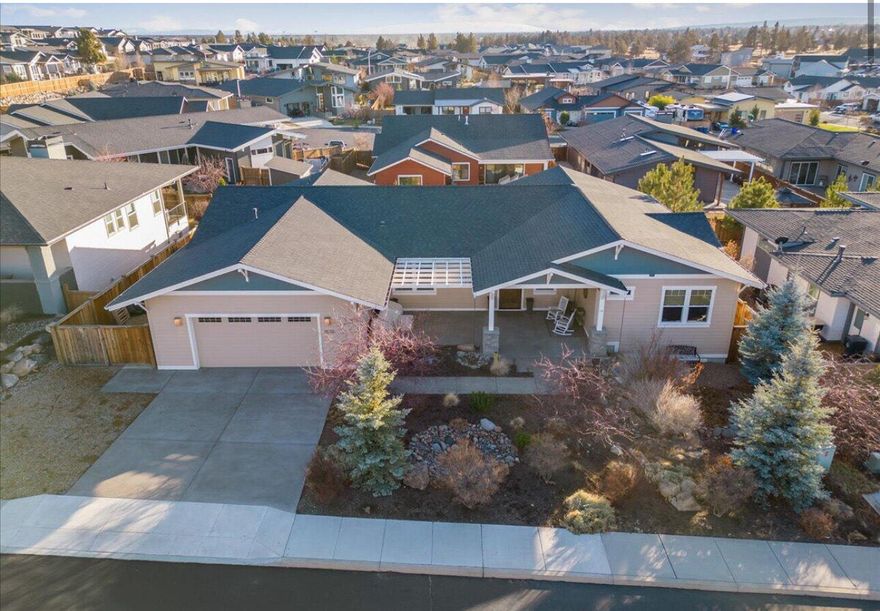 Welcome to this stunning single-level home where thoughtful design meets modern efficiency. No carpet, just gorgeous acacia floors throughout. The chef's kitchen features double islands, two sinks, double ovens, a gas cooktop, stainless appliances, and a walk-in pantry. The spacious primary suite offers mountain views, a walk-in closet, tiled shower, and air-jet soaking tub. Guests enjoy a mini-ensuite, while an additional bedroom, guest room with barn-door closet, and office with built-ins provide flexible space. Owned solar keeps the electric bill under $20/mo. Oversized 2-car garage with full attic storage, plus RV parking with hook-up. Outdoor living shines with xeriscaped front and back landscaping, a circular paver patio for a firepit or whatever else you would like to do in that area. Covered front & back patios with beautiful views. Natural gas BBQ, large laundry/mudroom with hidden storage, and so much more. Truly a must-see!