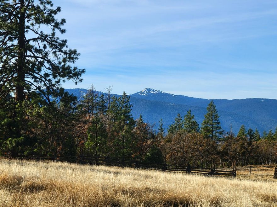 Escape to the tranquility of this beautiful 6.94-acre property in Ashland, Oregon, offering breathtaking mountain views and a perfect blend of open pasture, fenced areas, and serene forested landscape. Just 15 minutes from downtown Ashland, this prime location combines the best of both worlds: peaceful privacy with convenient access to the vibrant community and amenities of town. The land is ideal for animals and hobby farm use with a forested section providing a natural retreat with space to explore. Enjoy the quiet solitude with direct access to public lands for hiking, wildlife watching, or outdoor adventures. With the stunning backdrop of the mountains, this property offers endless possibilities for creating your own sanctuary. Whether you envision a hobby farm, an equestrian retreat, this Ashland gem offers it all. Don't miss your chance to own this slice of paradise - schedule a viewing!