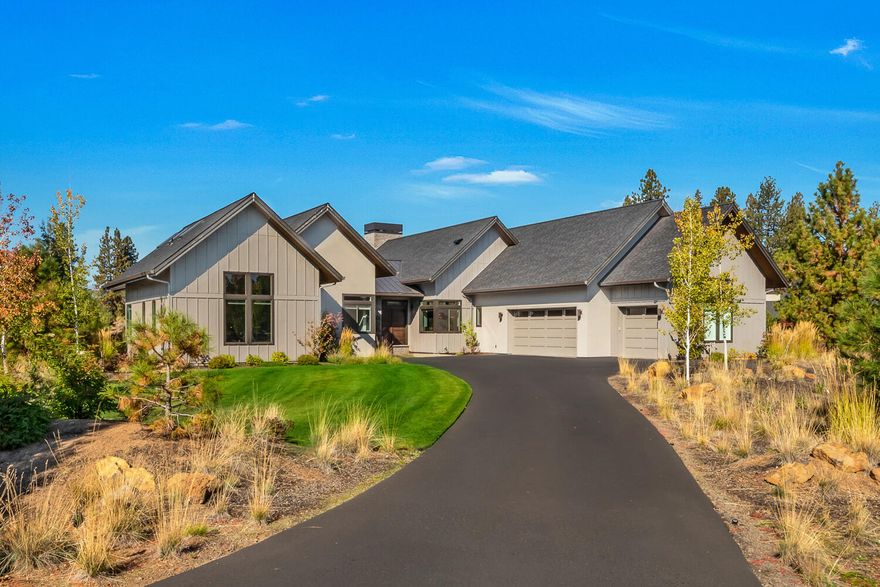 Stunning modern farmhouse set back from the 12th green on Tetherow. This house is buffered by a large common area on a quiet cul-de-sac. Tastefully renovated to include white oak vaulted ceilings, wood beams in the dining room and wood clad ceilings in the primary suite. Natural light abounds in the living room with custom concrete & shiplap fireplace. The entertainer's kitchen is accentuated by a stainless steel island, white shaker cabinets & Thermador appliances. The home lives primarily as a single level, with four ensuite bedrooms, an office & bonus room on the main level. The primary suite features a tranquil bathroom, tall ceilings, plenty of natural light through a pair of transom windows & great separation from the additional bedroom suites. The home is oriented in such a way in increase privacy while also providing views of the golf course, natural landscape & Cascade Mountains