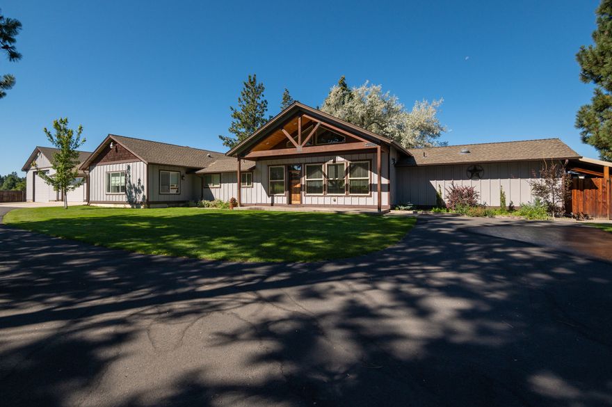 Custom single level home w/unobstructed Cascade Mountain Views, vaulted great room layout, 4 car attached garage, an attached 1,200sf heated/insulated RV Shop & new exterior paint. The great room has hardwood flooring in all the high traffic areas w/carpet in the living space. Two breakfast bars & granite counters along w/newer stainless appliances, amazing counter space, a huge pantry, & a spacious dining area create an entertainment area second to none. The primary suite is on the north end of the home separated from the other bedrooms & has mountain views from the bed, a well-organized closet, & nicely laid out bathroom w/enclosed toilet & custom tiled shower. The home has 2 large guest bedrooms, a den, bonus room, & a nicely separated in-law suite w/private entrance, bedroom, & full bath. Outside you're greeted by an oasis that is easily maintained w/an extensive automated sprinkler system, many mature trees, & huge stamped concrete patios w/spa & covered areas in the front & back.