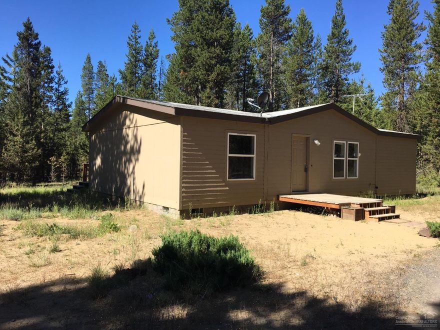 3 Bedroom 2 Bath, 1188 Sq Ft Mfg Home. Home sits back on 4.79 acres, with trees and privacy. Tons of potential with this property with plenty of space to build a shop.