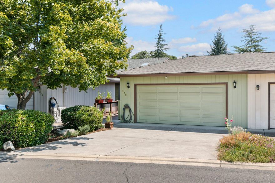 Beautifully updated Medford Heights townhome. Sellers have updated kitchen, baths, flooring and more to create a stylish & comfortable home. The kitchen has yards of solid-surface counters, stainless steel double wall oven & cooktop, lots of cabinets & redwood decorative shelving. In the open plan living/dining area, a cathedral ceiling accentuates the spacious feeling. A wall of windows lets in sunlight, while a gas fireplace with floor-to-ceiling tiled surround creates a dramatic focal point. A large deck provides outdoor living space & views of the lush lawn & distant mountains. A bedroom & full bath on the main level allow for one-level living, with two bedrooms, bath and additional deck downstairs. The lower bathroom has a gorgeous custom-tiled shower & double-sink vanity. An extra-large walk-in closet, media/game room & HUGE storage area mean room for lots of stuff!  Additional updates include LED lighting; new decks upstairs & more. All this, plus a community pool & clubhouse!