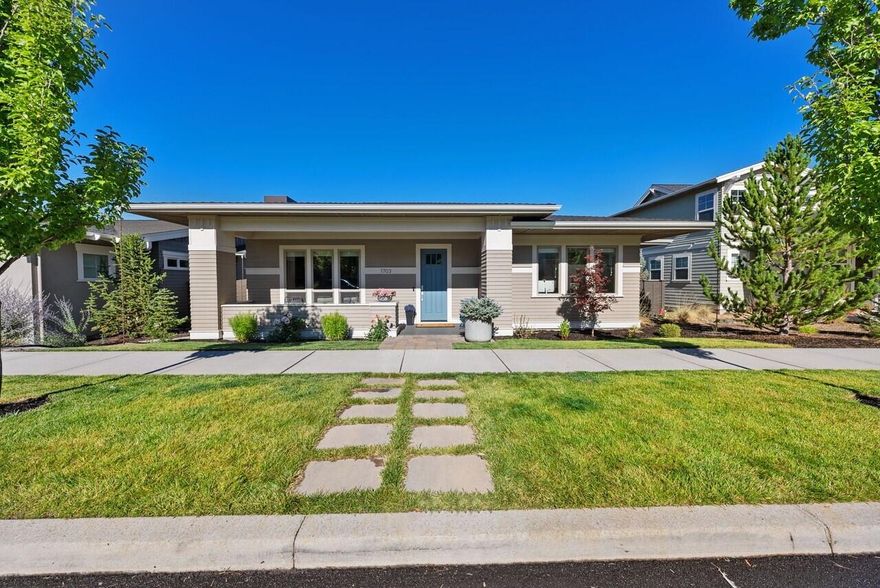 Highly sought-after single-level Prairie-style home in the heart of Northwest Crossing! This light-filled open floor plan features hardwood floors, a modern gas fireplace, and custom built-ins. The spacious kitchen includes a large island, quartz countertops, and stainless steel appliances. Enjoy 10' ceilings with upgraded LED disc lights featuring a nightlight function. The primary suite boasts a walk-in closet, tile shower, and double vanity. Step outside to a fully fenced backyard with a covered patio—perfect for gatherings or quiet evenings—plus a charming front patio for morning coffee. Smart irrigation in both front and back yards. Functional laundry room with sink and built-in cabinets, Hunter Douglas window treatments, and oversized 2-car garage plus 3rd driveway space. Minutes from Discovery Park, schools, coffee shops, restaurants, bars, and the vibrant summer Saturday market. A perfect blend of peaceful living and Bend's best amenities.