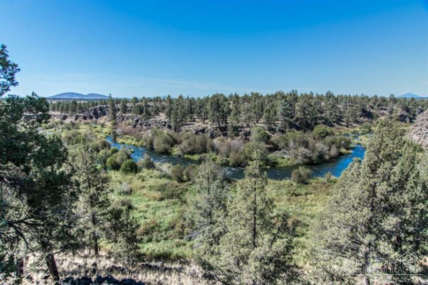 The entire package here--hard-to-find views overlooking the Deschutes River (up and down river)w/ sweeping views of the Cascade Mtns & more, on 2 quiet & peaceful acres, but only mins to town/services--the ultimate Central OR getaway--now reasonably priced! Split level w/ all the main living on upper level + Loft, all Beds down w/access from Master to lower patio. Ext just painted, recent new carpet, roof & appliances. 3rd garage bay used as shop/storage. Close & enjoy an amazing C.O. Fall!