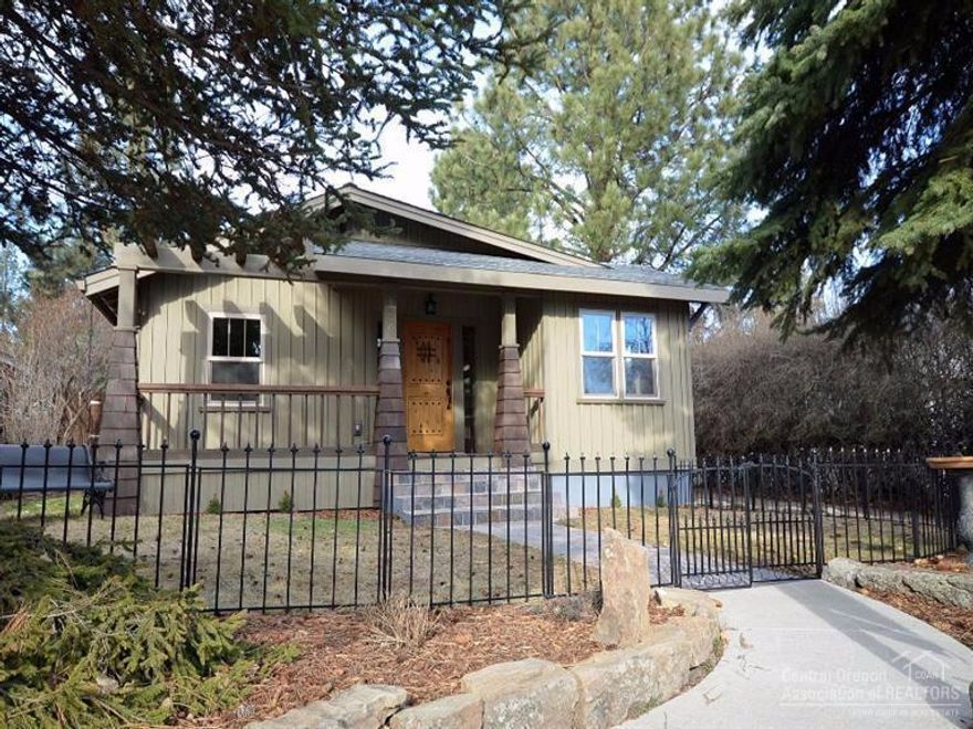 Galveston Oh Galveston! THE west side Bend location. Complete custom remodel of this 1920's Old World Craftsman charmer. Handscraped hickory hardwood and true travertine floors, river-washed slab granite counter top and handcrafted knotty alder cabinets. Vaulted pine ceiling with exposed beams, full basement with epoxy floor. Fenced with two separate yard areas, alley access and RV parking, Huge attached over-sized garage. All just a few blocks to restaurants, cafes, breweries and Drake Park on the river.