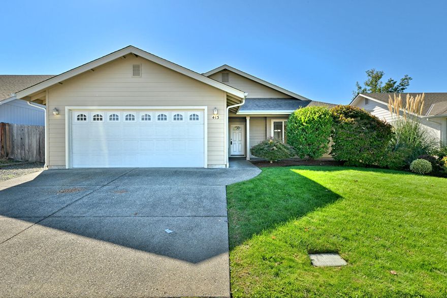 This inviting 3-bedroom, 2-bath home offers 1,442 sq. ft. of comfortable living on an easy-care 6,534 sq. ft. lot. The open layout features vaulted ceilings, a bright kitchen with an eating bar and plenty of storage, and seamless flow through the living and dining areas. Enjoy the fully fenced backyard with a covered patio—perfect for relaxing or entertaining. Energy-efficient with paid-off solar, central heating and cooling, and low-maintenance landscaping. A finished 2-car garage adds convenience, and the quiet neighborhood offers easy access to shopping, dining, and schools. Clean, comfortable, and truly move-in ready!
