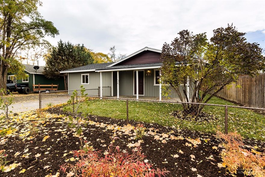 A lot of sq.footage with Tons to offer! 3 bedrooms, a large living, bonus room, utility & mud room. All new kitchen cabinets, counter tops, back splash, new appliances, including refrigerator and microwave. Laminate in living & bedroom areas. Tile entry flows into the kitchen, carpet in the huge bonus room. Gas hot water and gas range/oven. Slider off the dining area to a patio & fenced back yard. Alley access to huge backyard w/RV parking. New roof. Convenient location! Vacant and move-in ready!