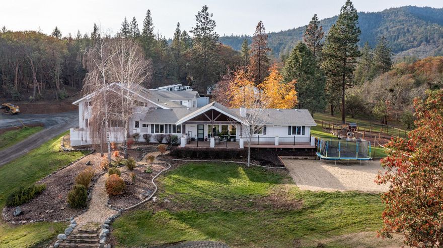 Beautiful home on 22+ acres with a country feel and less than 1-mile from historic Jacksonville. This two-story home features a large covered front porch with great mountain views, main level of living and an upstairs bonus room for a potential two-family setup or home office. This home was remodeled in 2019 and features an open floor plan, main floor master suite with private deck, split floor plan with all bedrooms on the main level. There is a lot of room for hobbies with an attached finished 2+ car garage with an extra room behind, a large finished detached shop with 220. The grounds are abundant with wildlife. Multiple deck/patio areas, a sand volleyball court, trails, chicken coop, fenced garden area and Jackson Creek. This would make a great horse property. Across from the Britt trailhead for access to miles of trails.