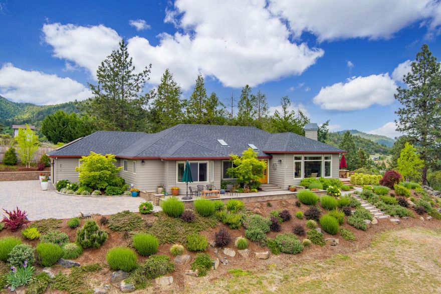 Spectacular private, gated property with stunning single level home beautifully updated in 2018. Light filled open concept living with walls of windows providing amazing mountain and valley views.  Wonderful indoor and outdoor spaces for entertaining and enjoying lap pool and views from new deck. Gourmet kitchen with SS appliances, Wolf cooktop, double ovens, quartz countertops and custom cabinets with soft close. Great room with gas fireplace, granite surround and built in bookcases. Hardwood floors throughout. Two bedrooms, two baths, office/den and bonus room. Property deer fenced and professionally landscaped with drip irrigation. Oversized two car garage and large outbuilding. A must see property to appreciate.